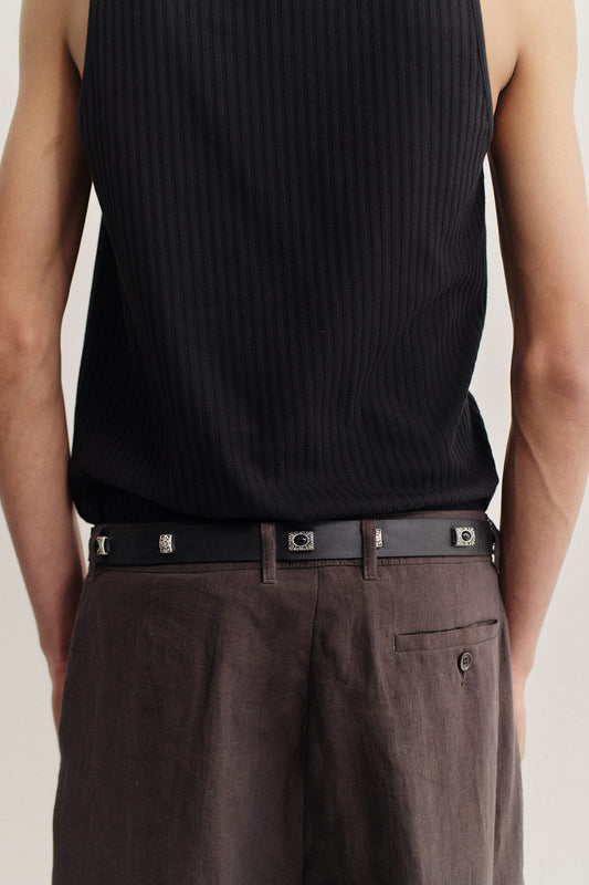 Men's accessories belt, black calf leather with vintage silver-tone metal embellishments.