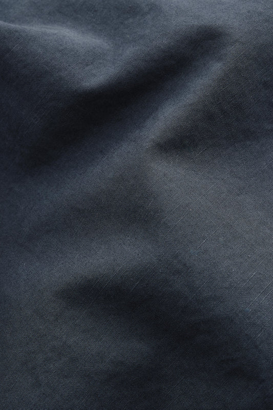 Men's long-sleeved shirt jacket, cotton-linen blend, garment dyed, dark navy, with natural structure.