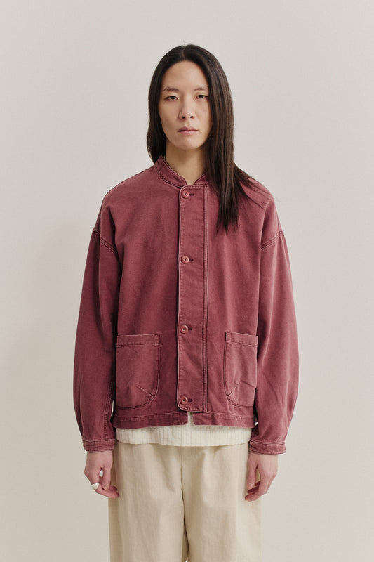 Men's outerwear jacket, organic cotton, stone washed, faded red, with stand collar and patch pockets.