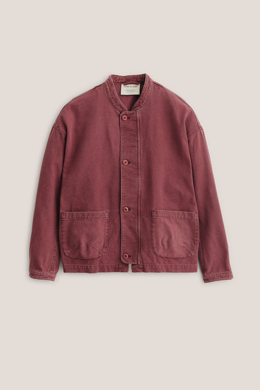 Men's outerwear jacket, organic cotton stone-washed, faded red, with stand collar and patch pockets.