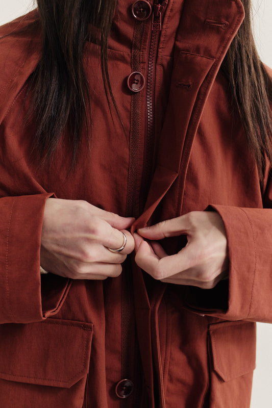 Men's outerwear jacket, Zambezi Fisher, in water-repellent cotton blend, rust red, with bellows pockets and button closure.