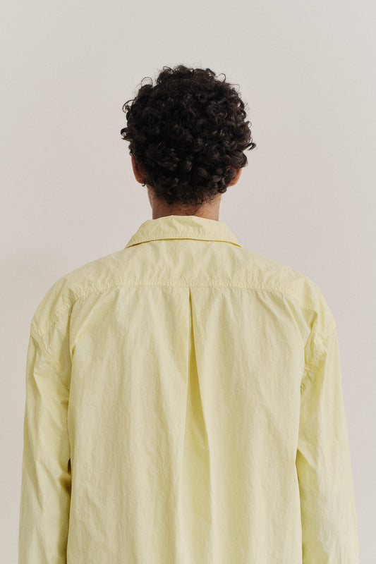 Men's long-sleeved shirt, recycled polyamide, garment-dyed light yellow, with an oversized silhouette.