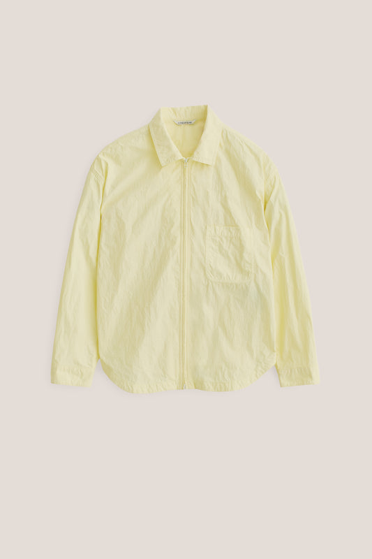 Men's long-sleeved shirt, recycled polyamide, garment-dyed light yellow, with two-way zipper and patch pocket.