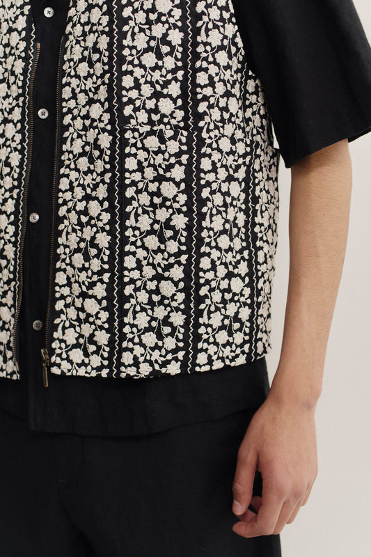 Men's outerwear vest, cotton, black with white embroidered flower blocks, metal zipper.