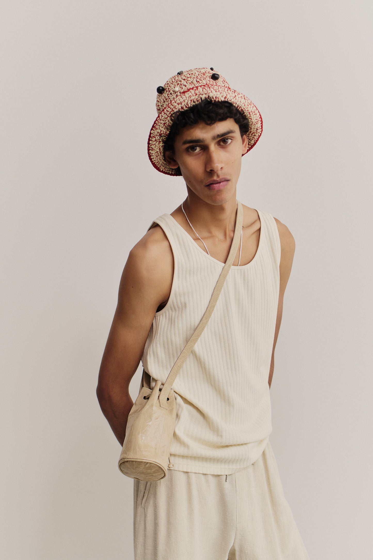 Men's accessories, Ndogo Bag, 100% lwg-certified calf leather, mini round bucket bag, crossbody wear, light tone.