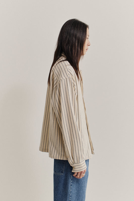 Men's long-sleeved shirt, cotton and recycled cotton blend, off-white with navy engineered stripes, wide boxy fit.