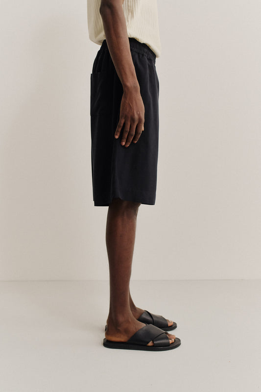Men's shorts, 100% lyocell heavy twill, soft black, wide leg with elastic waist and side pockets.