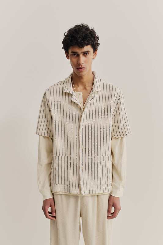 Men's short-sleeved shirt, cotton mix, off-white with navy stripes, rounded spread collar, double patch pockets.