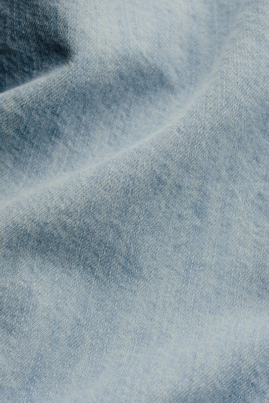 Men's short-sleeved shirt, light blue organic cotton and silk denim with vintage-inspired texture.
