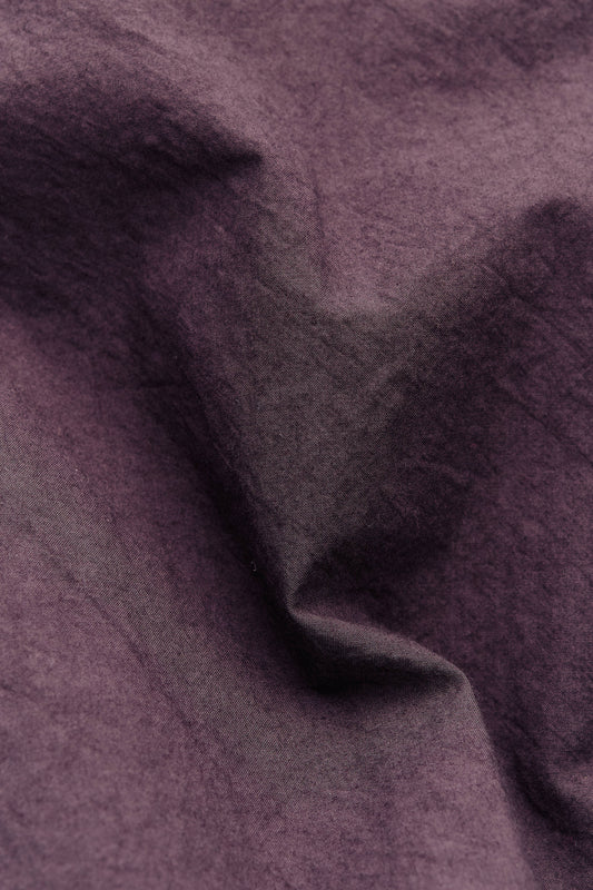 Men's short-sleeved shirt, 100% cotton, smooth yet subtly grainy surface, purple.