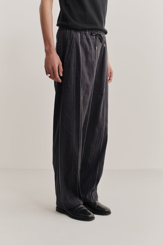 Men's long pants, cotton-linen blend, black with subtle white stripes, wide straight fit, elasticated waist.