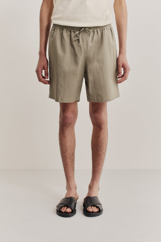 Men's shorts, lyocell-cotton-linen twill, sun-bleached sage, with adjustable waistband and side pockets.