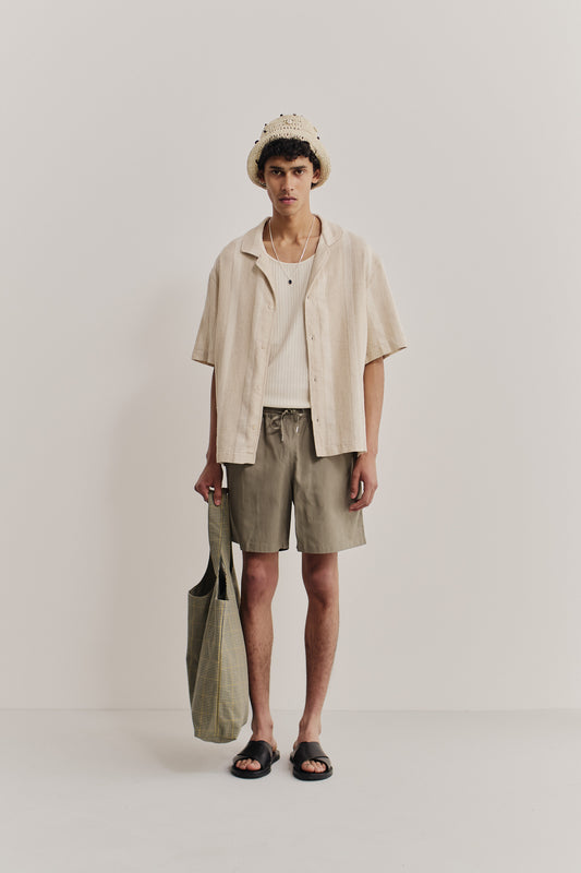 Men's shorts, lyocell-cotton-linen twill, sun-bleached sage, with side pockets and adjustable waistband.