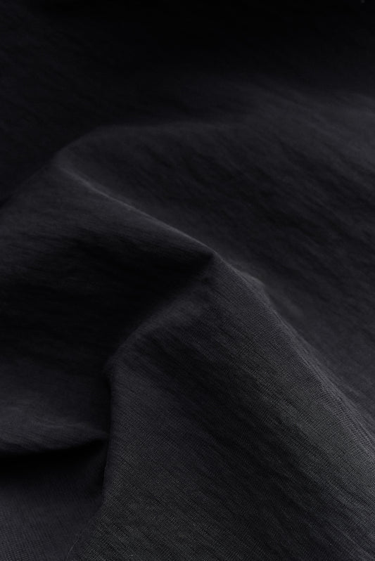 Men's outerwear, Zambezi Fisher Jacket fabric, black recycled nylon and cotton blend, water-repellent.