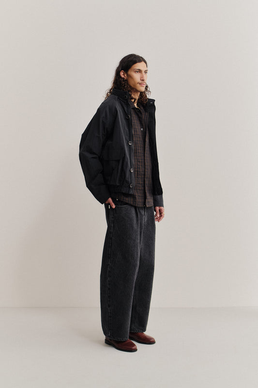 Men's outerwear, black recycled nylon cotton blend Zambezi Fisher Jacket with bellows pockets.