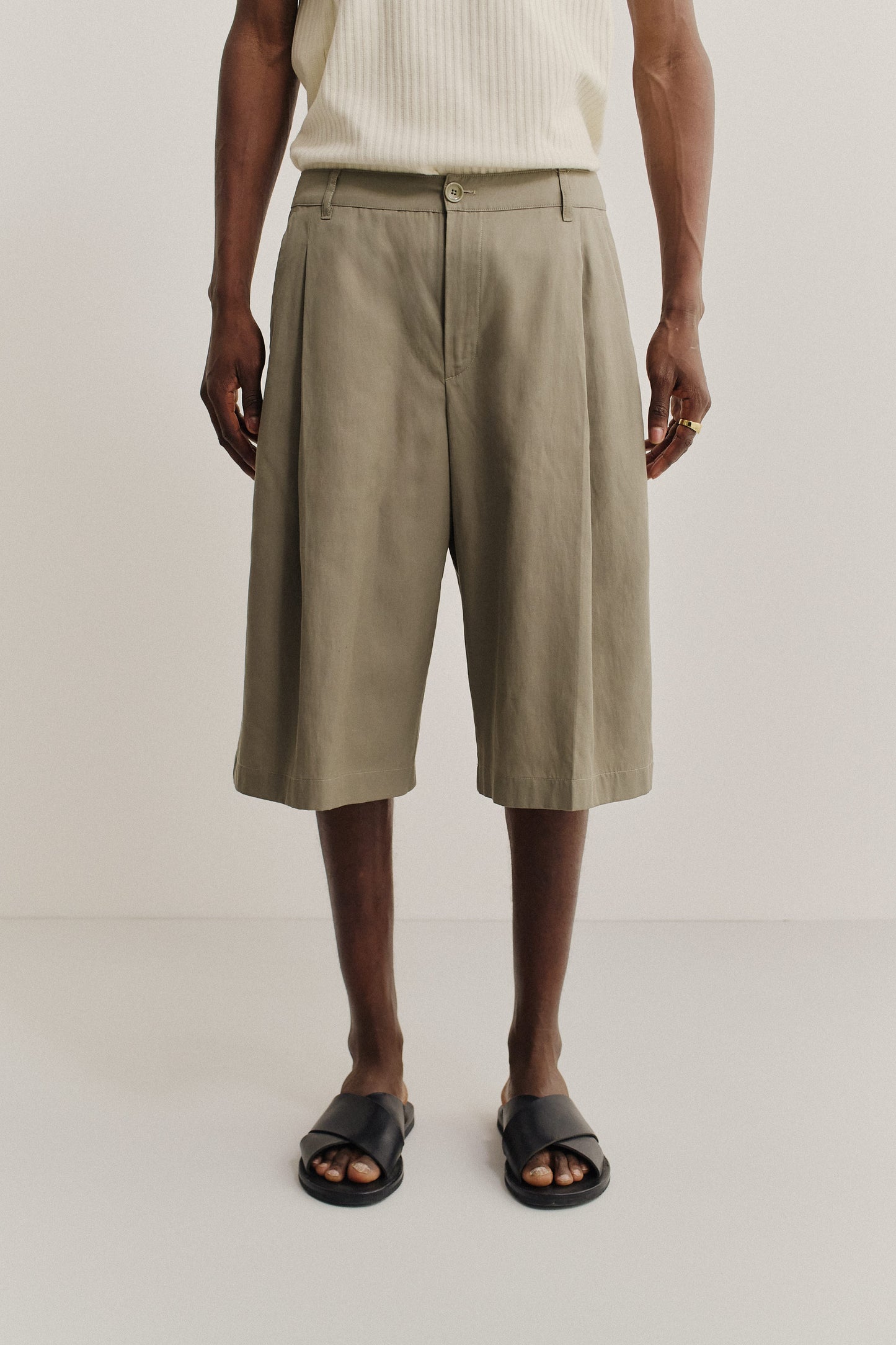 Men's shorts, lyocell-cotton-linen twill, sun-bleached sage, knee-length, relaxed fit, wide leg, single pleat.