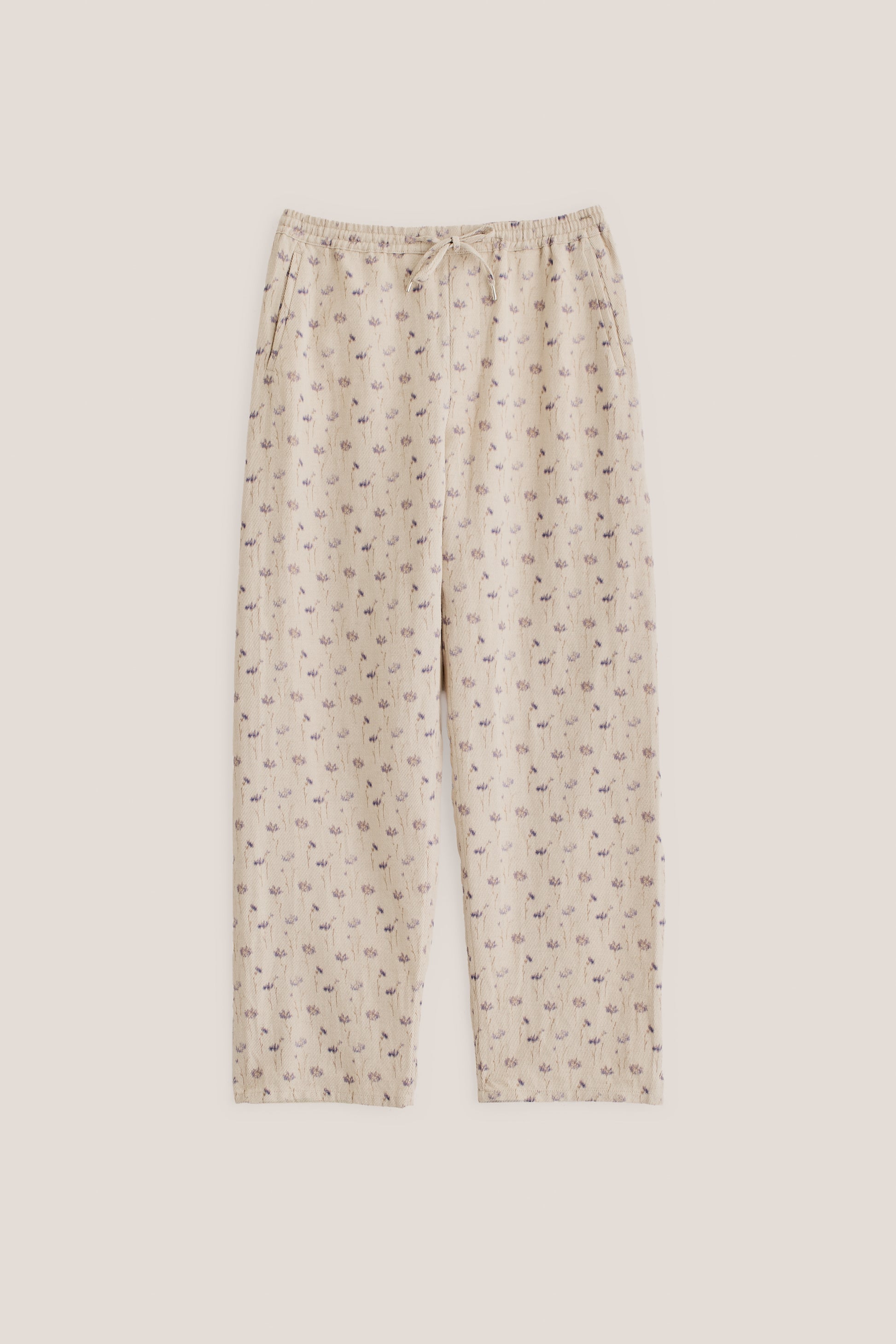 Men's long pants, cotton-linen blend twill, ecru with subtle lilac/brown floral print, elastic waist.