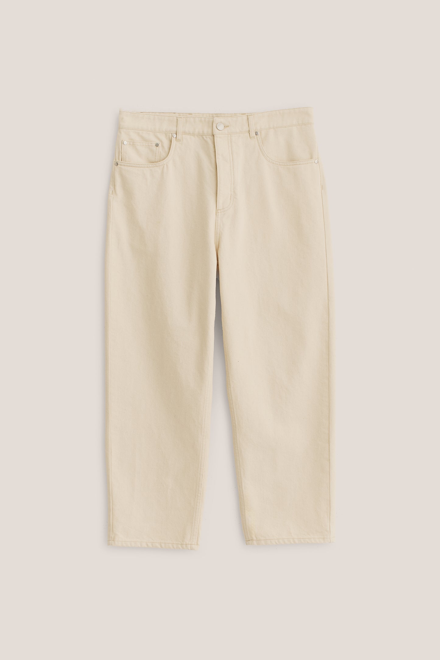 Men's long pants, organic cotton raw denim, pre-washed, off-white, loose fit, tapered leg, cropped length.