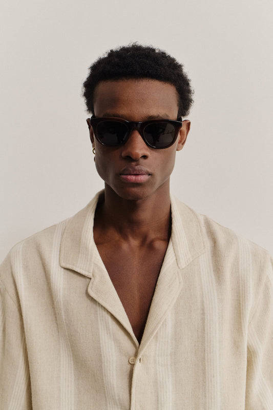 Men's accessories, dark brown acetate Acapulco sunglasses with round curvy frame, keyhole, and thick square temples.