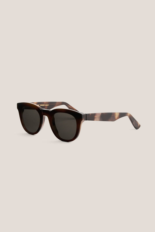 Unisex accessories sunglasses, handmade acetate, dark tortoise shell, round-shaped frame with keyhole bridge and thick square temples.