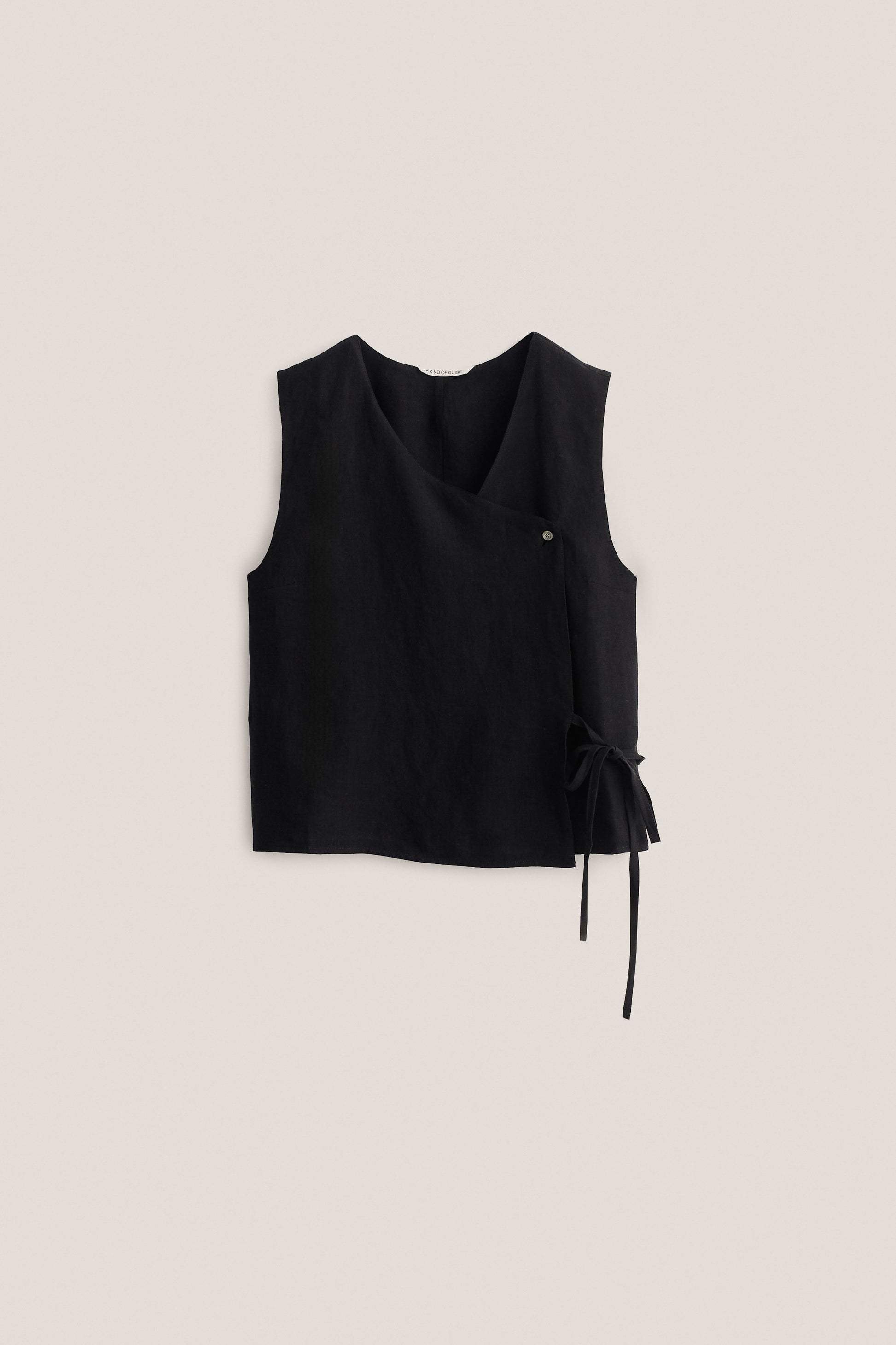 Women's sleeveless shirt, black 100% linen, asymmetric wrap front with V-neck, button, and side tie.