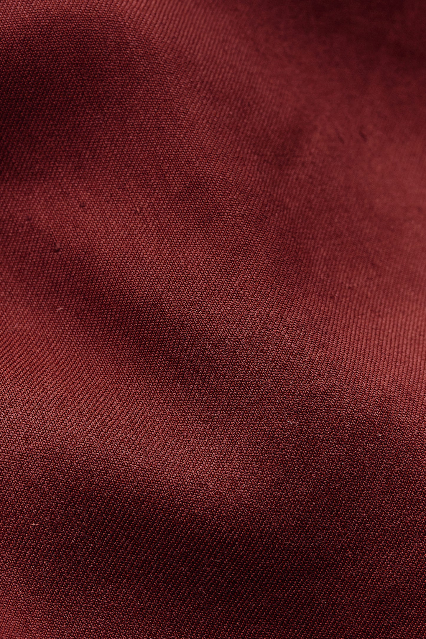 Women's sleeveless wrap shirt in a refined linen, virgin wool, and mohair blend, prunelle weave, in a rich red hue.