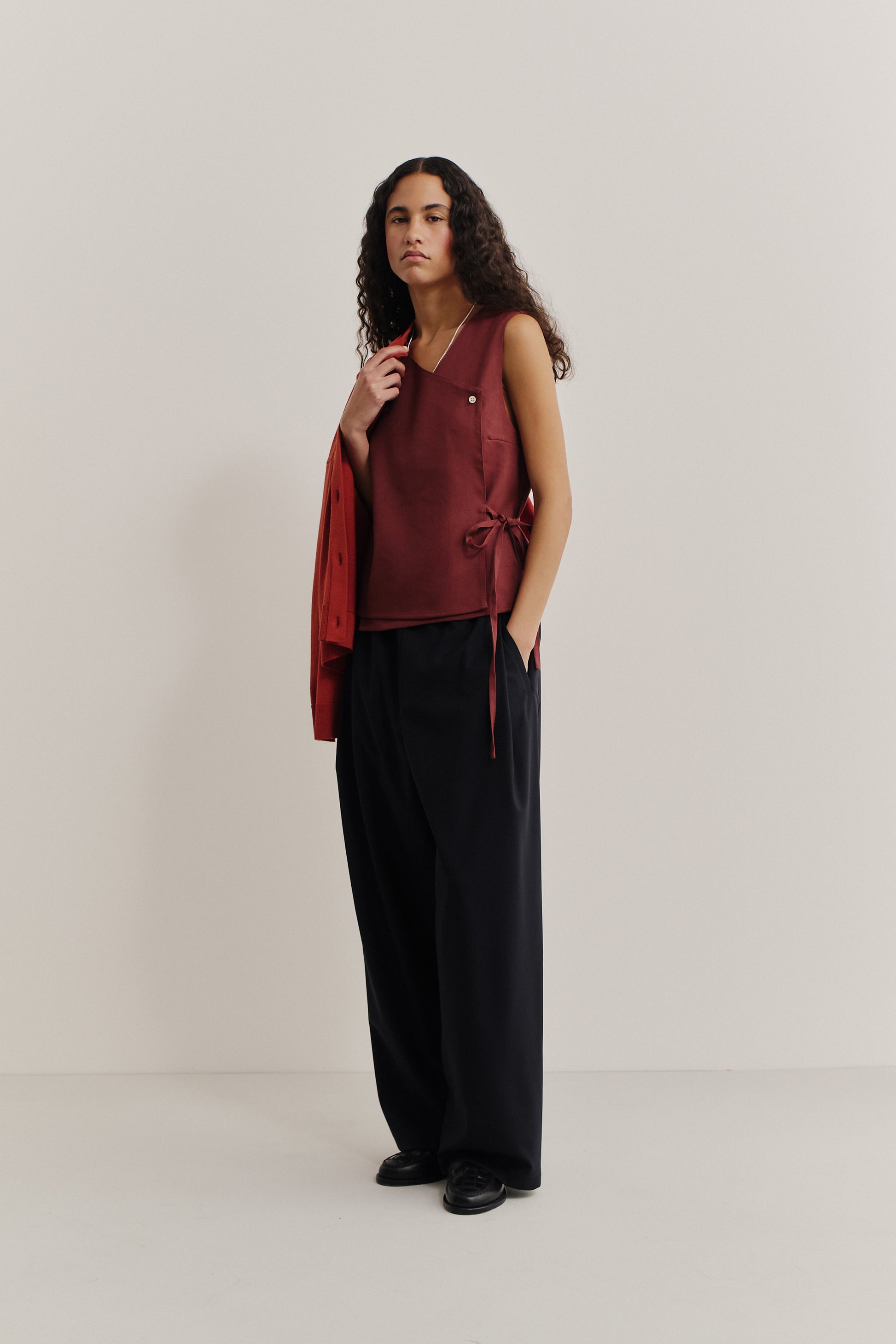 Women's sleeveless shirt, linen-wool-mohair blend, asymmetric wrap front, V-neck, button closure, adjustable side ties, terracotta.