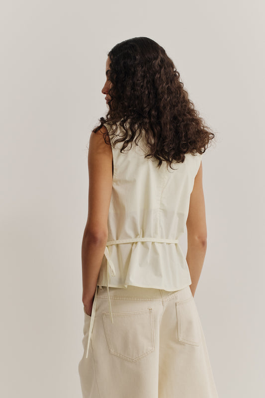Women's sleeveless wrap shirt, organic cotton, garment washed, light yellow.