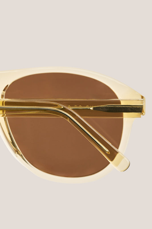 Unisex accessories sunglasses, handcrafted aviator-shaped acetate, light beige frame with brown Carl Zeiss lenses.