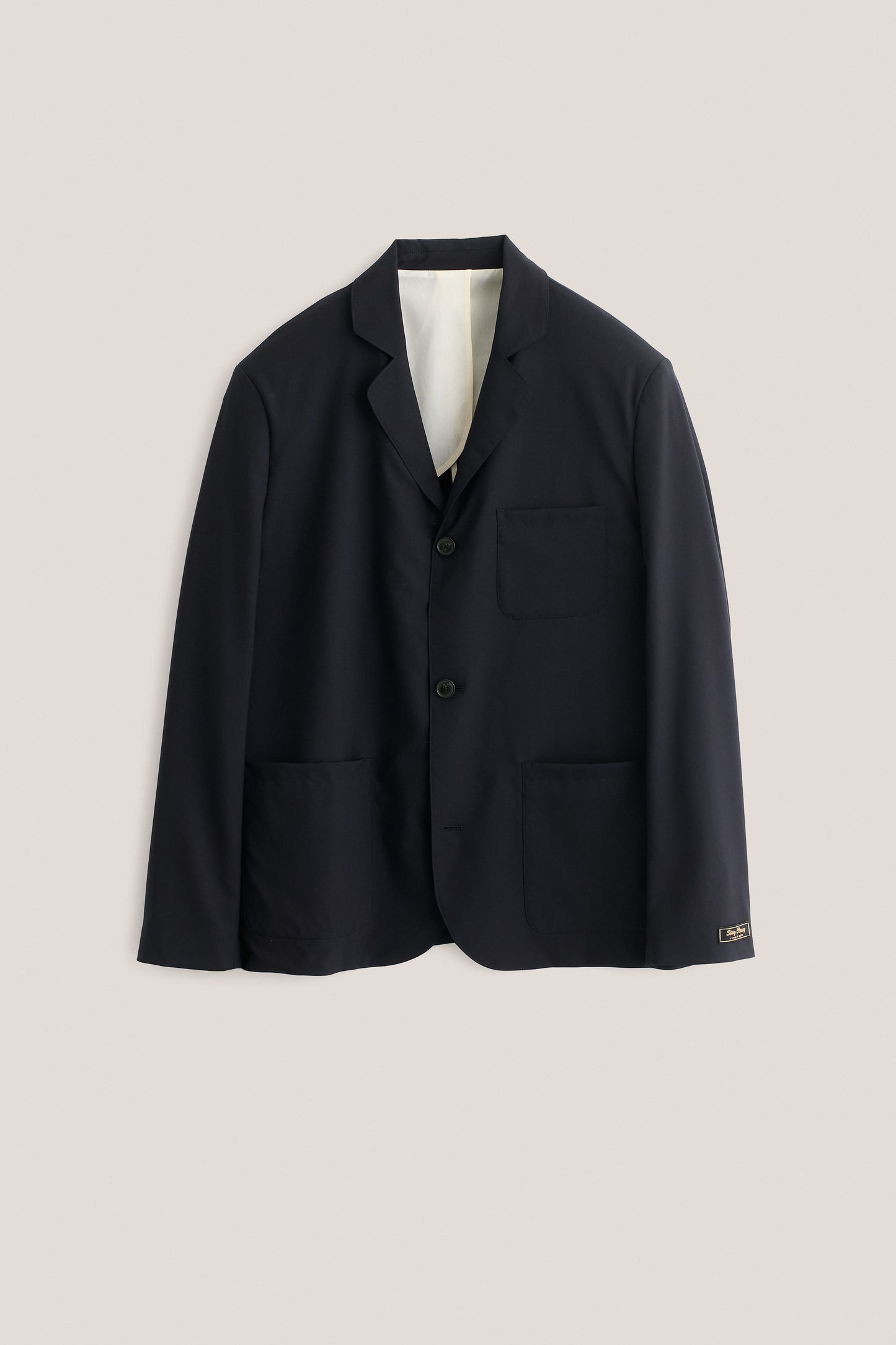 Men's tailoring blazer, 100% virgin wool, dark navy, with three patch pockets and rounded lapel.