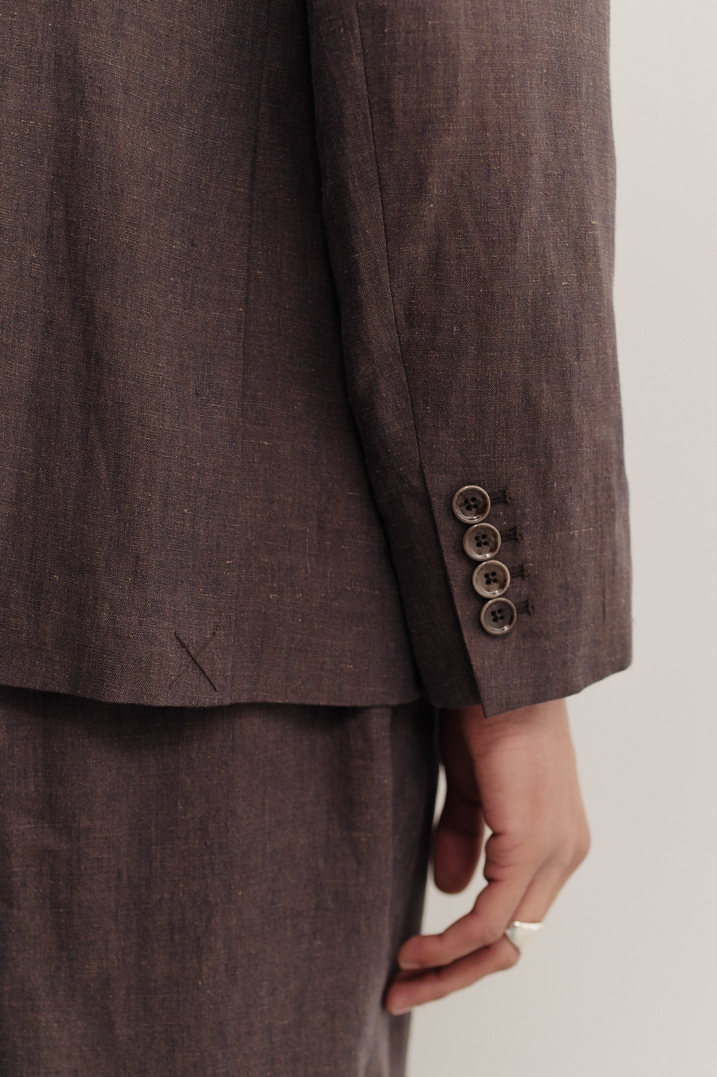 Men's tailoring, double-breasted peak blazer, 100% linen, canvas weave, brown, with sleeve buttons.
