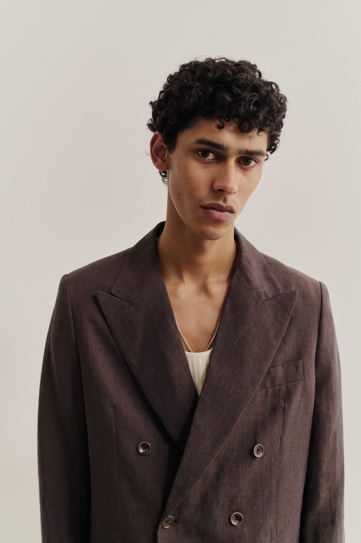 Men's tailoring, double-breasted peak blazer in brown 100% linen with a lively surface effect.