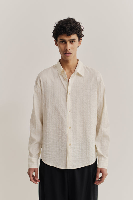 Men's long-sleeved shirt, cotton-silk-linen blend, washed, off-white with subtle textured stripes.