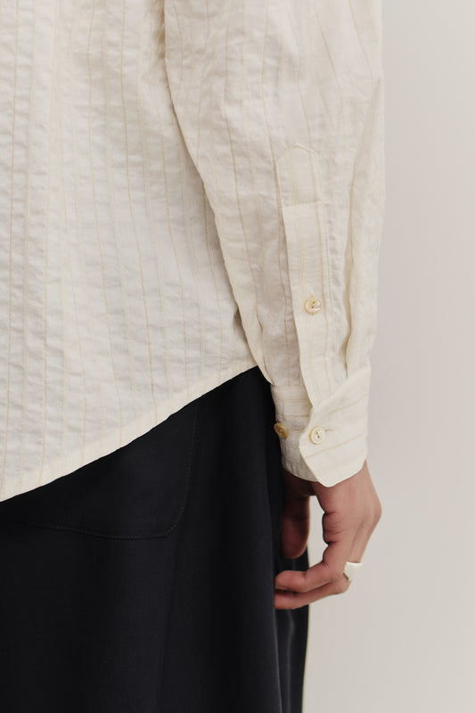 Men's long-sleeved shirt, cotton-silk-linen blend, washed, off-white with subtle stripes.