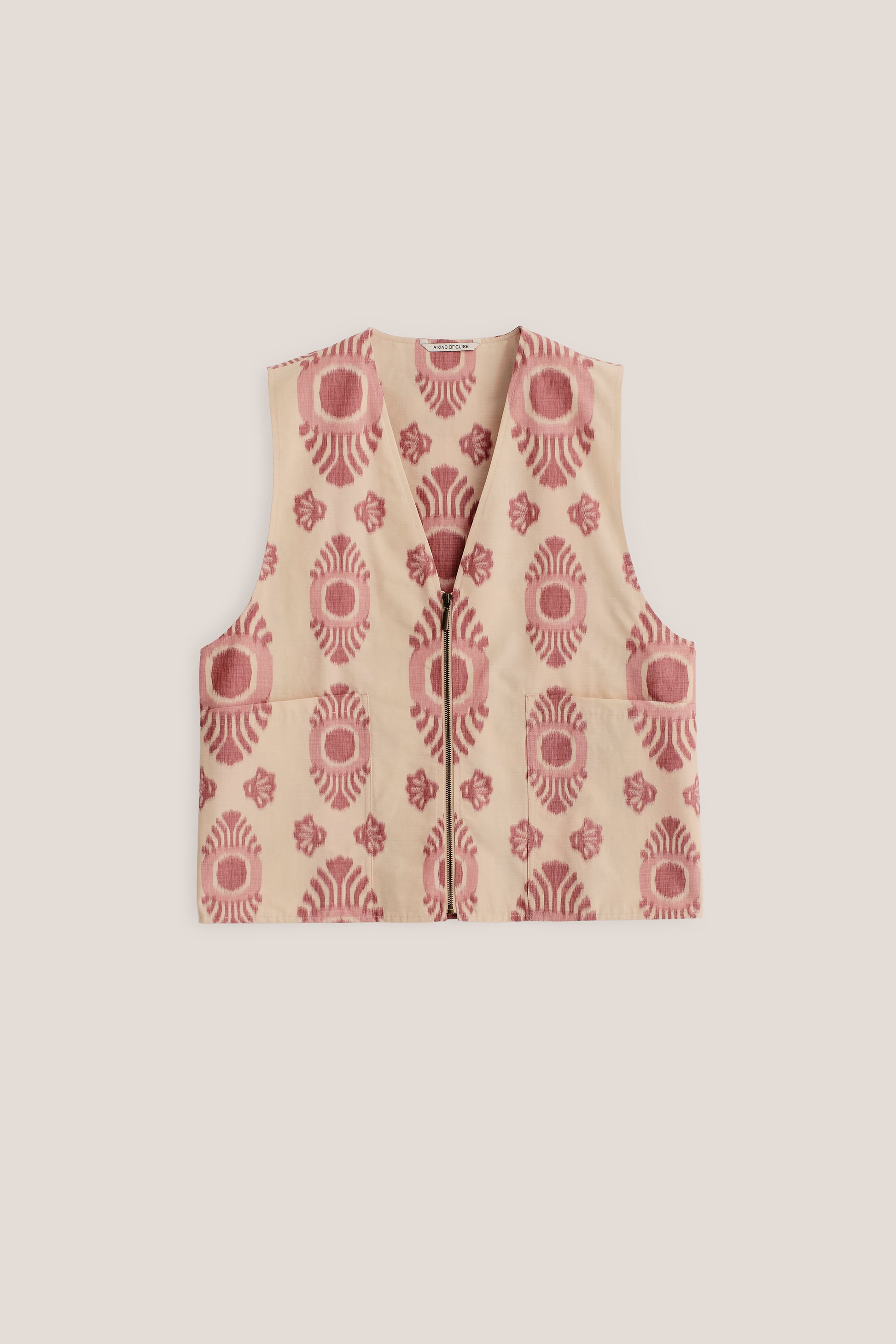 Men's outerwear vest, cotton-recycled polyester blend, ikat-patterned, beige with red motif, metal zipper, two patch pockets.