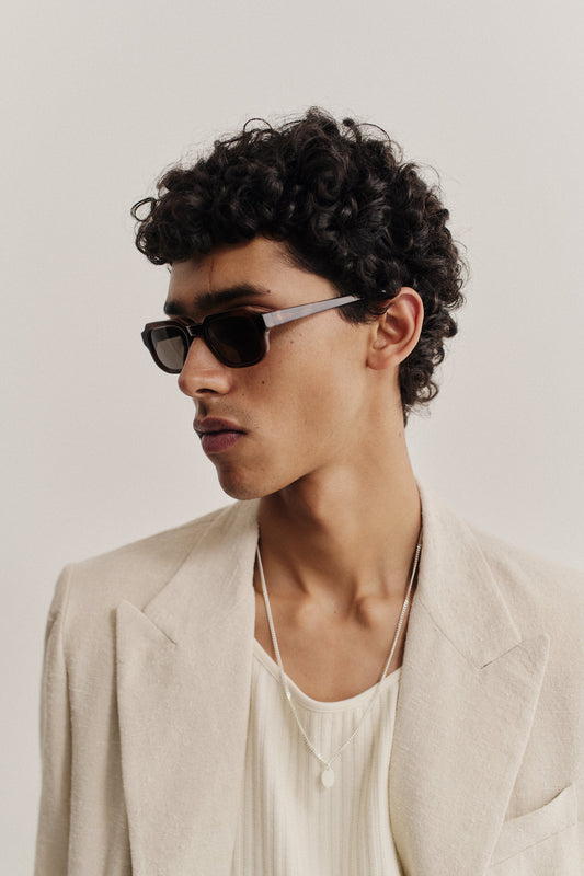 Men's accessories, rectangular acetate sunglasses with dark lenses and a beige frame.
