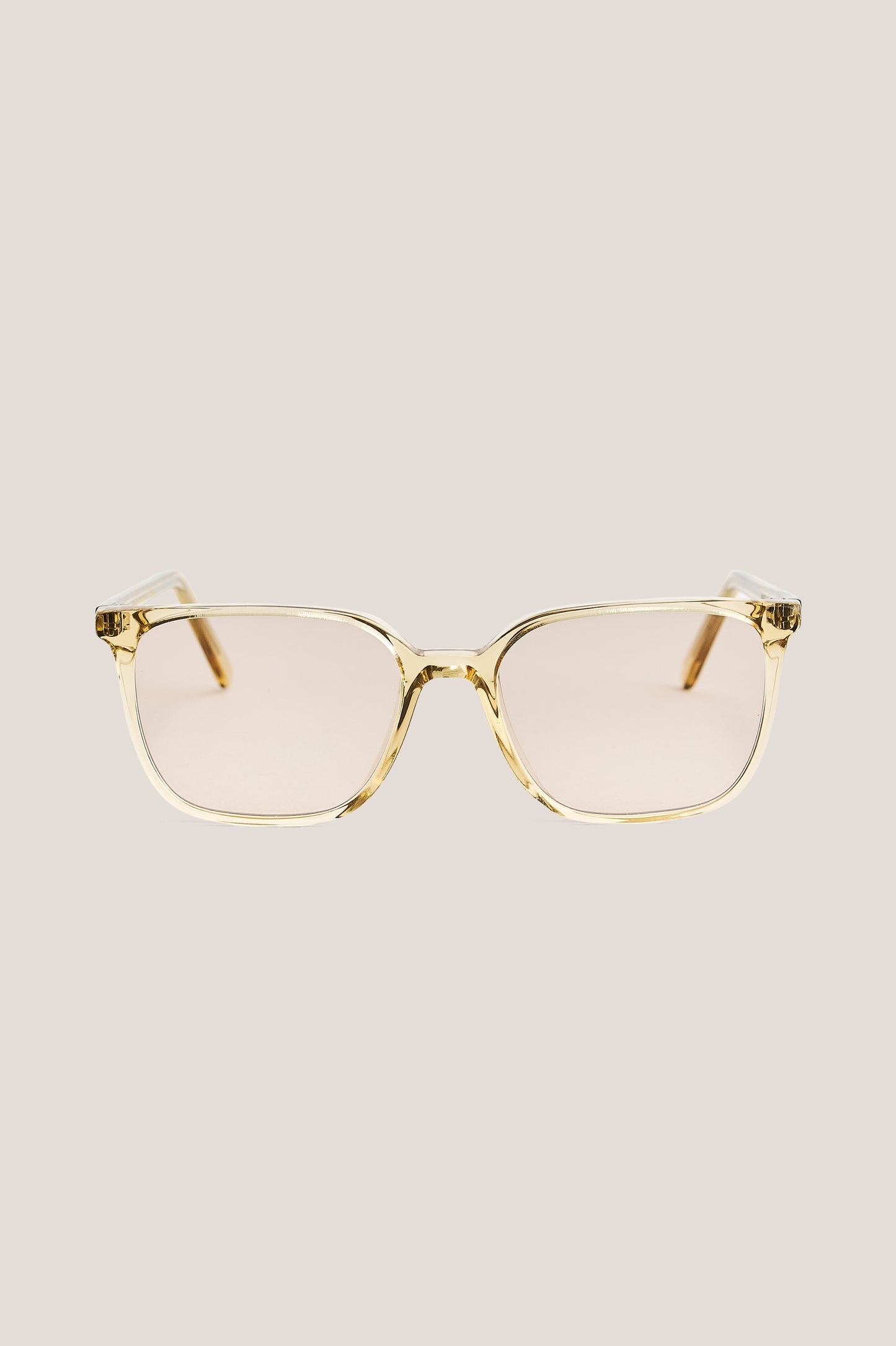 Unisex accessories sunglasses, 100% acetate, light brown frame with peach-tinted Carl Zeiss lenses.
