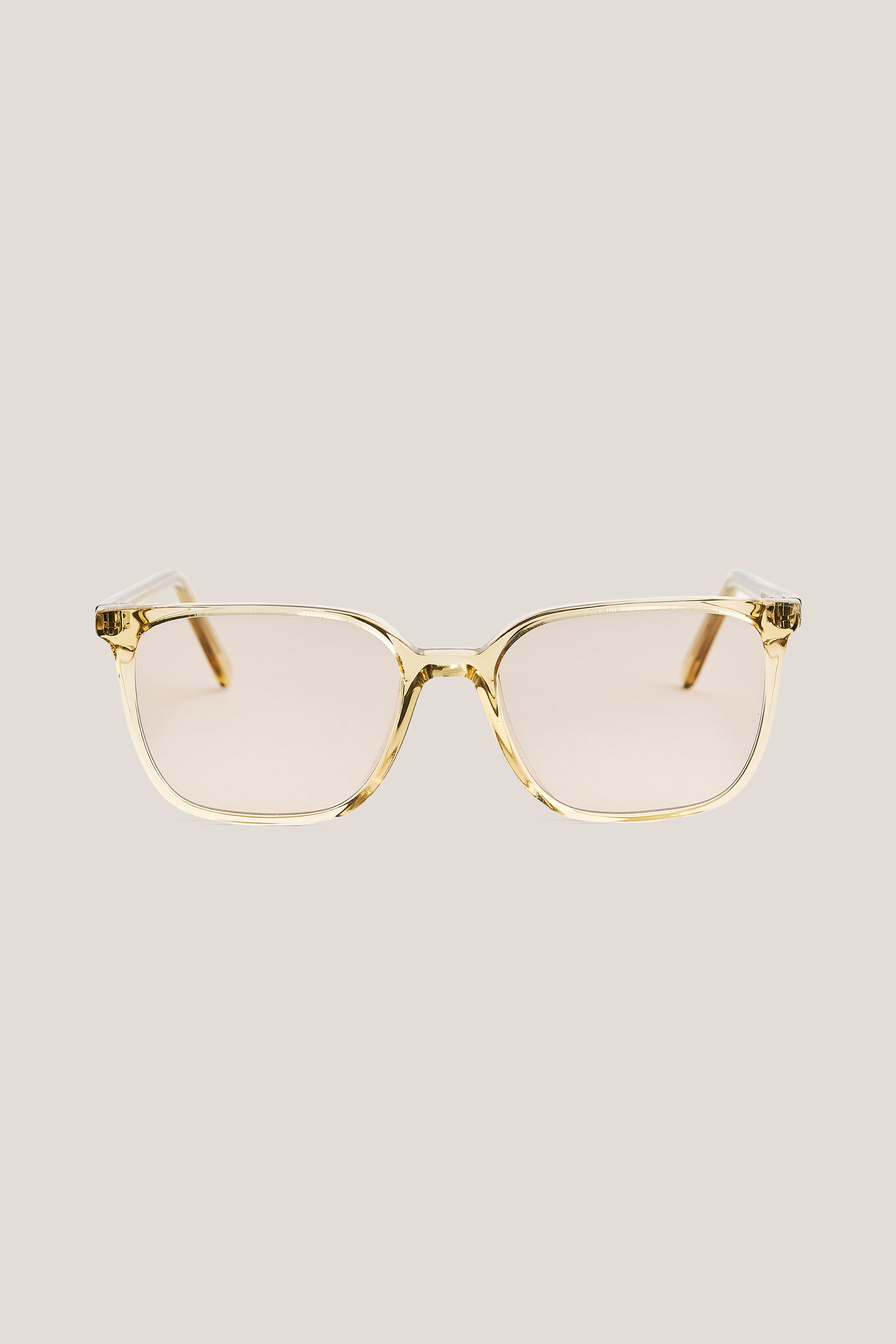 Unisex accessories sunglasses, 100% acetate, light brown frame with peach-tinted Carl Zeiss lenses.