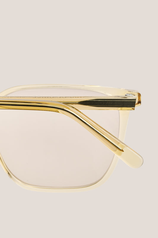 Unisex accessories sunglasses, transparent beige acetate frame with gold temples and light lenses.