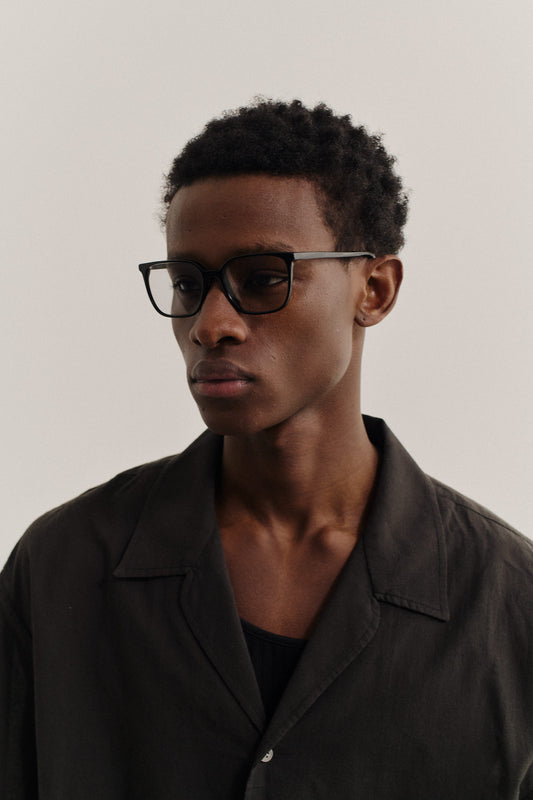Unisex accessories sunglasses, black acetate frame with dark Carl Zeiss lenses.