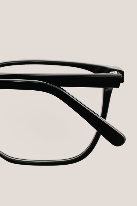 Unisex accessories eyeglasses, black acetate frame with clear lenses, close-up of temple and hinge.