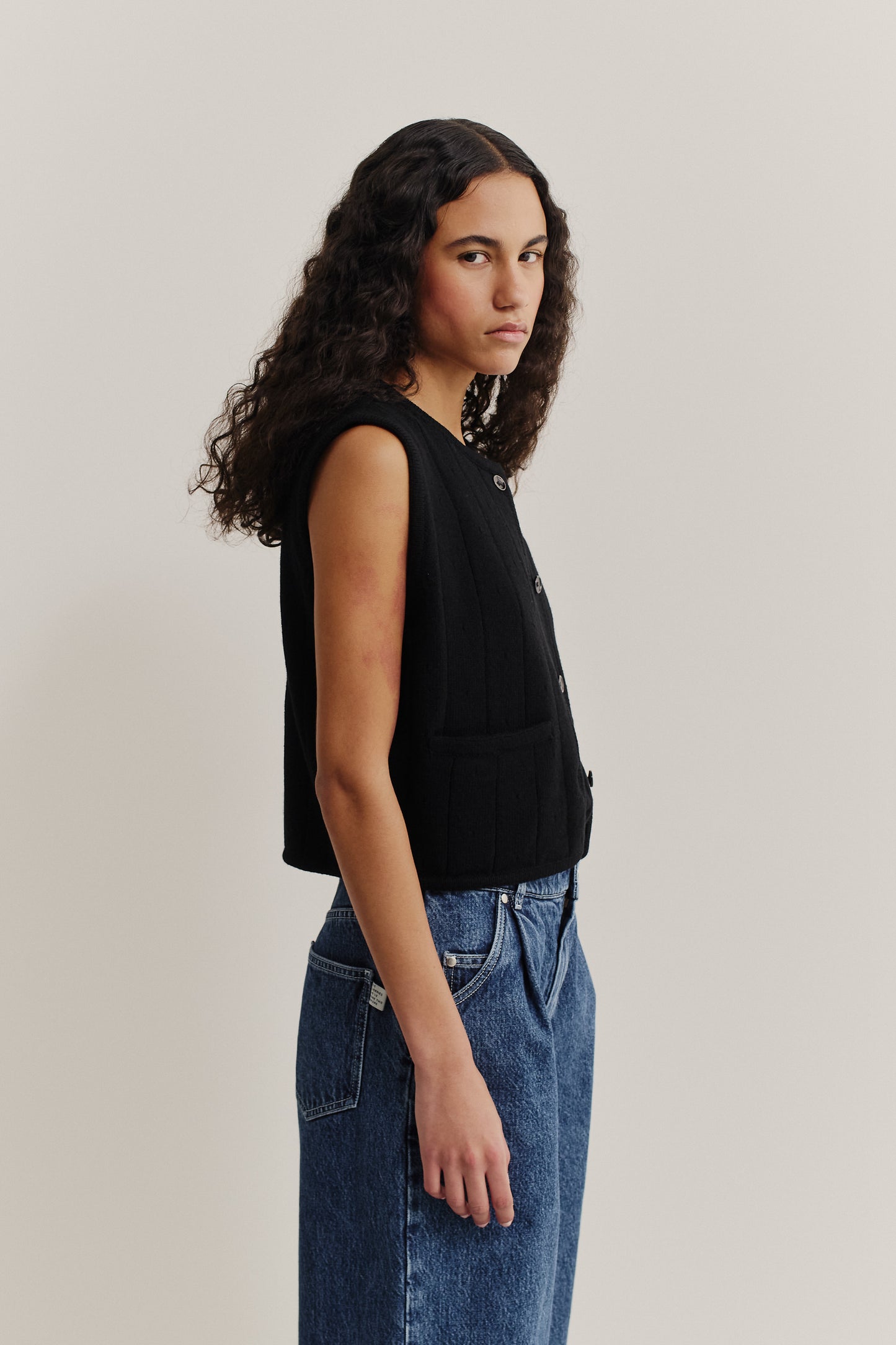 Women's knit vest, black 100% merino wool, cropped ajour knit with button front.