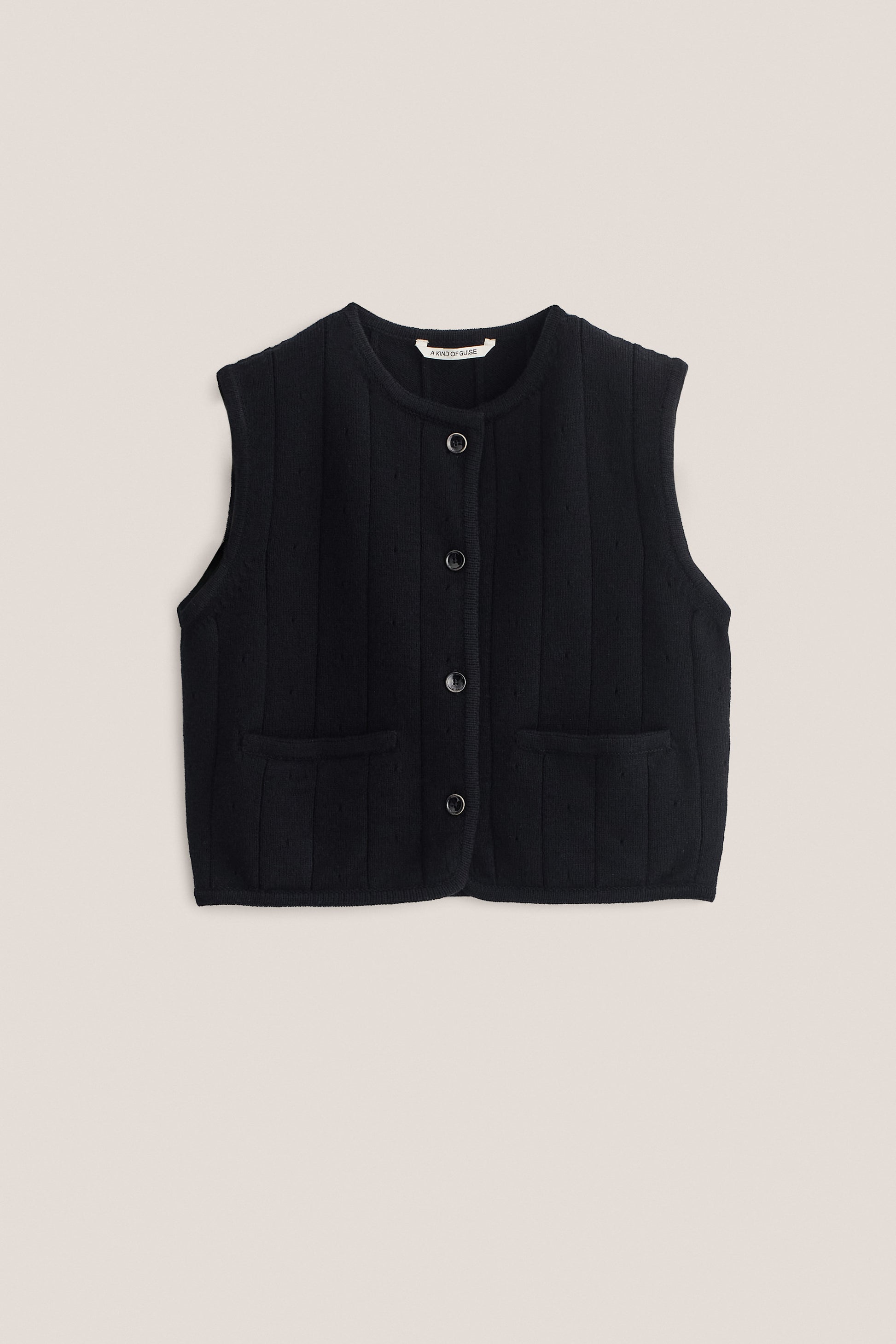Women's knit vest, black 100% merino wool, cropped, ajour knit pattern, button-front, two patch pockets.