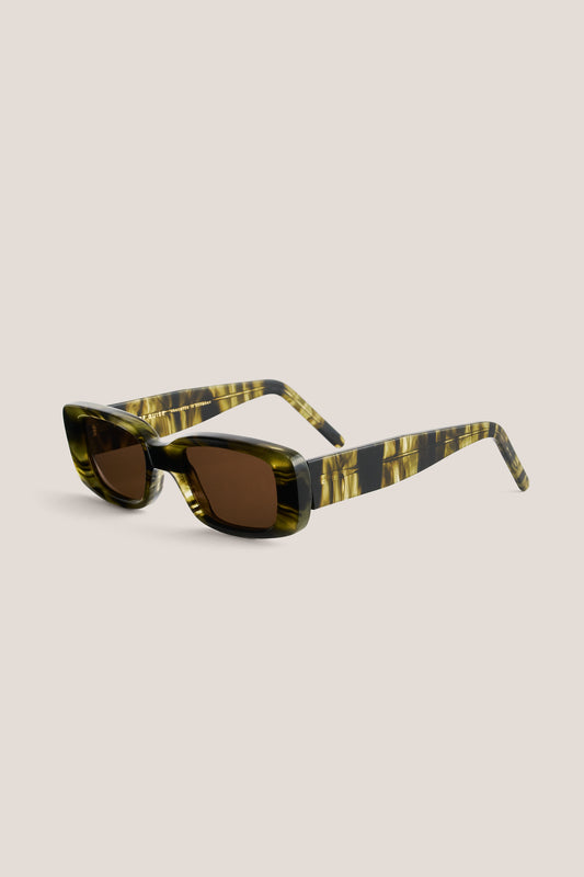 Unisex accessories sunglasses, ODESSA, wide and narrow acetate frame in green and black tortoise pattern with brown Carl Zeiss lenses.