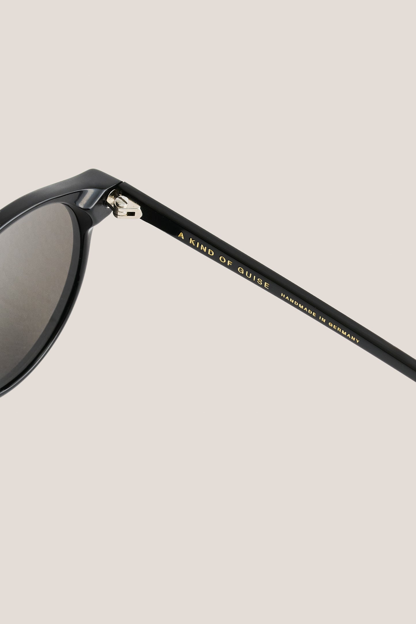 Unisex accessories sunglasses, black acetate, thick square frames, grey Carl Zeiss lenses, "A KIND OF GUISE" on temple.