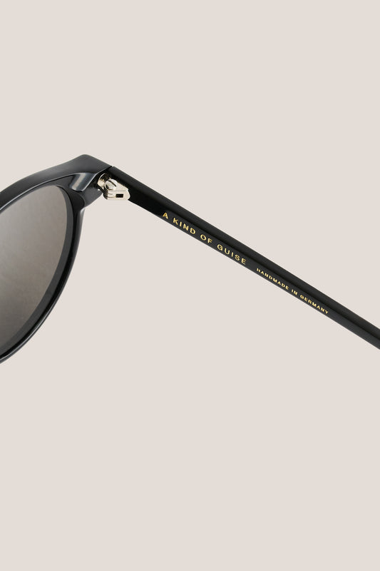 Unisex accessories sunglasses, black acetate, thick square frames, grey Carl Zeiss lenses, "A KIND OF GUISE" on temple.