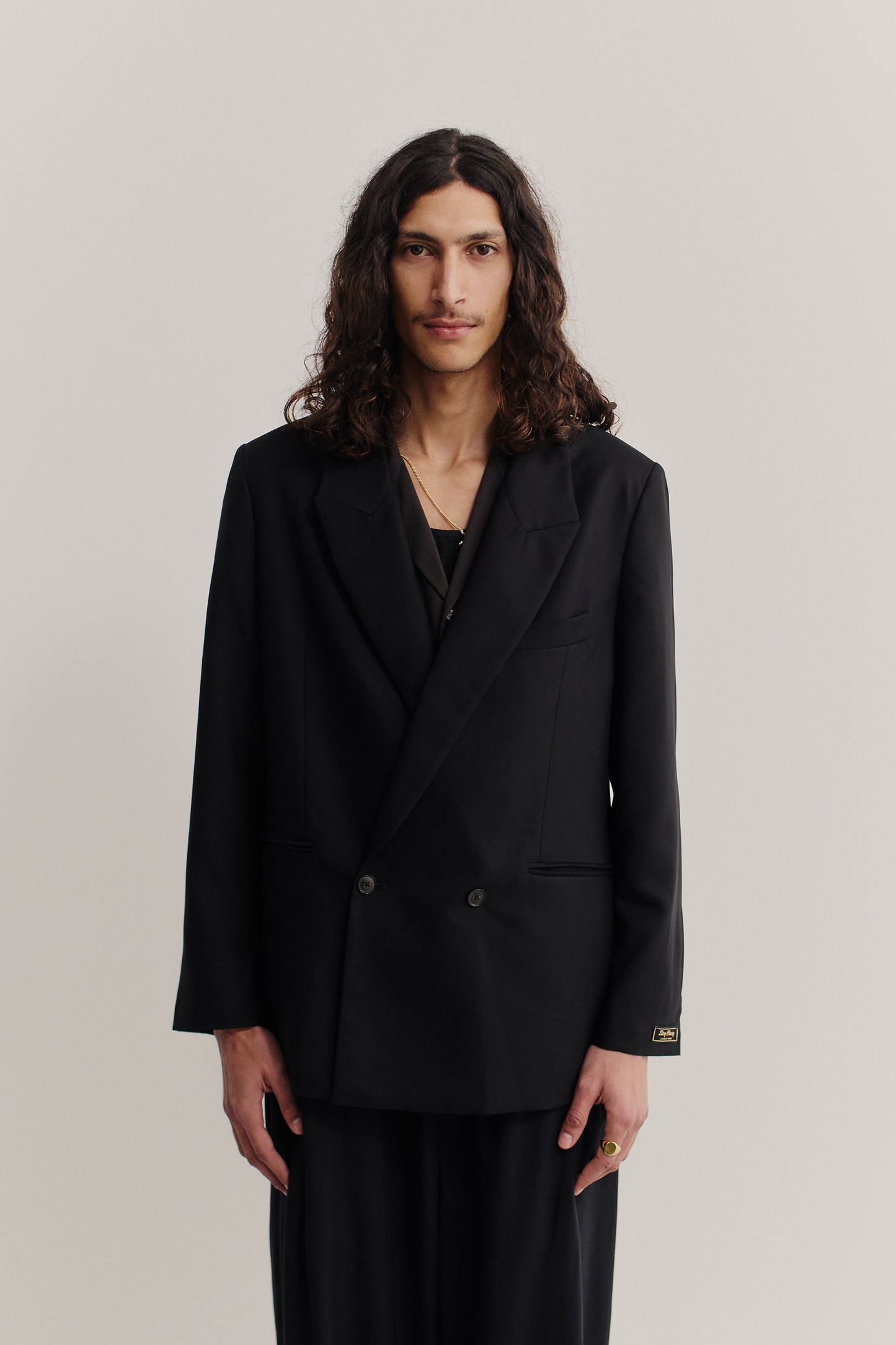 Men's tailoring, double-breasted blazer, lyocell twill, black, relaxed fit, with "stay classy" label.