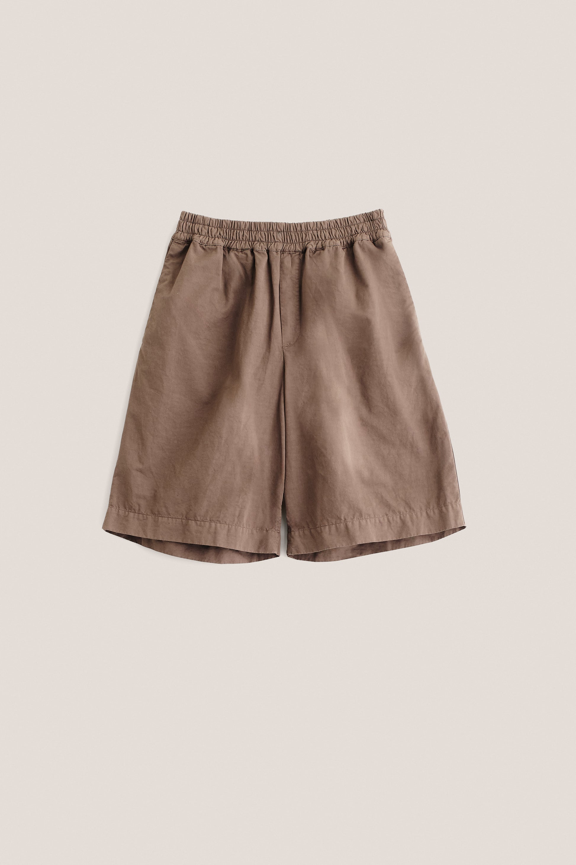 Men's shorts, cotton-linen blend, garment-dyed brown, with elastic waist and wide leg.