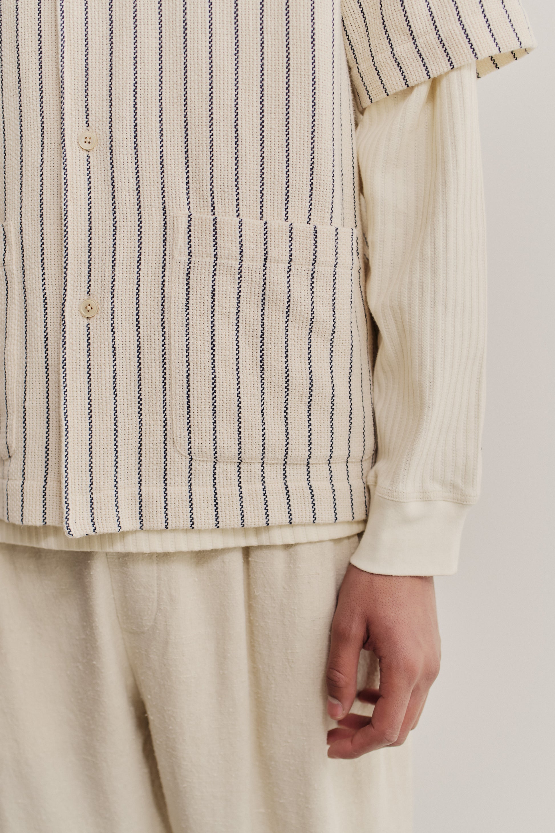 Men's short-sleeved shirt, cotton and recycled cotton blend, off-white with navy stripes, double patch pockets.