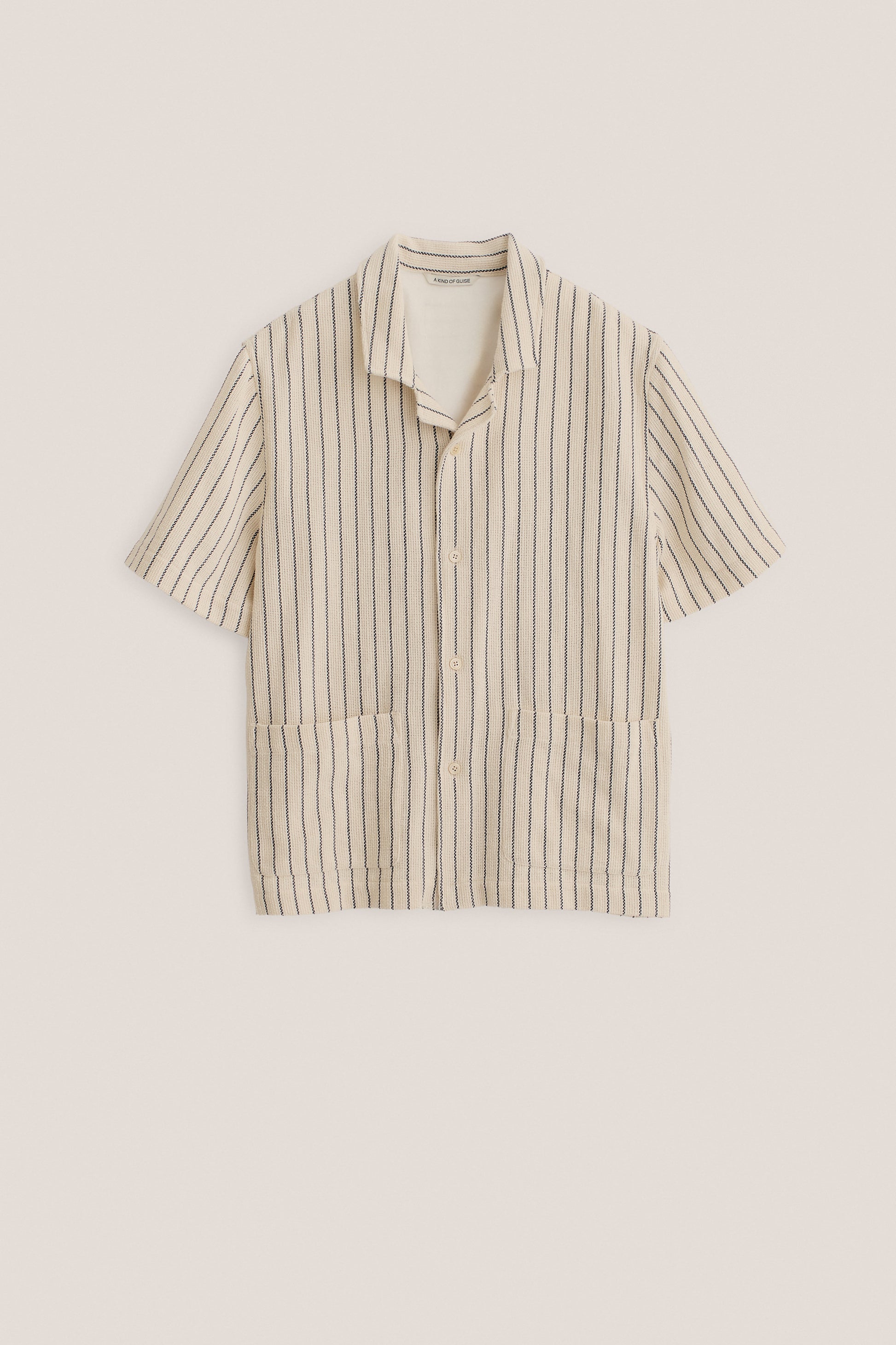 Men's short-sleeved shirt, cotton mix, off-white with navy engineered stripes, rounded spread collar, double patch pockets.